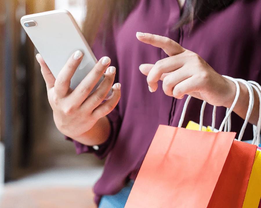 Online shopping on laptop with cart icon - Pexels